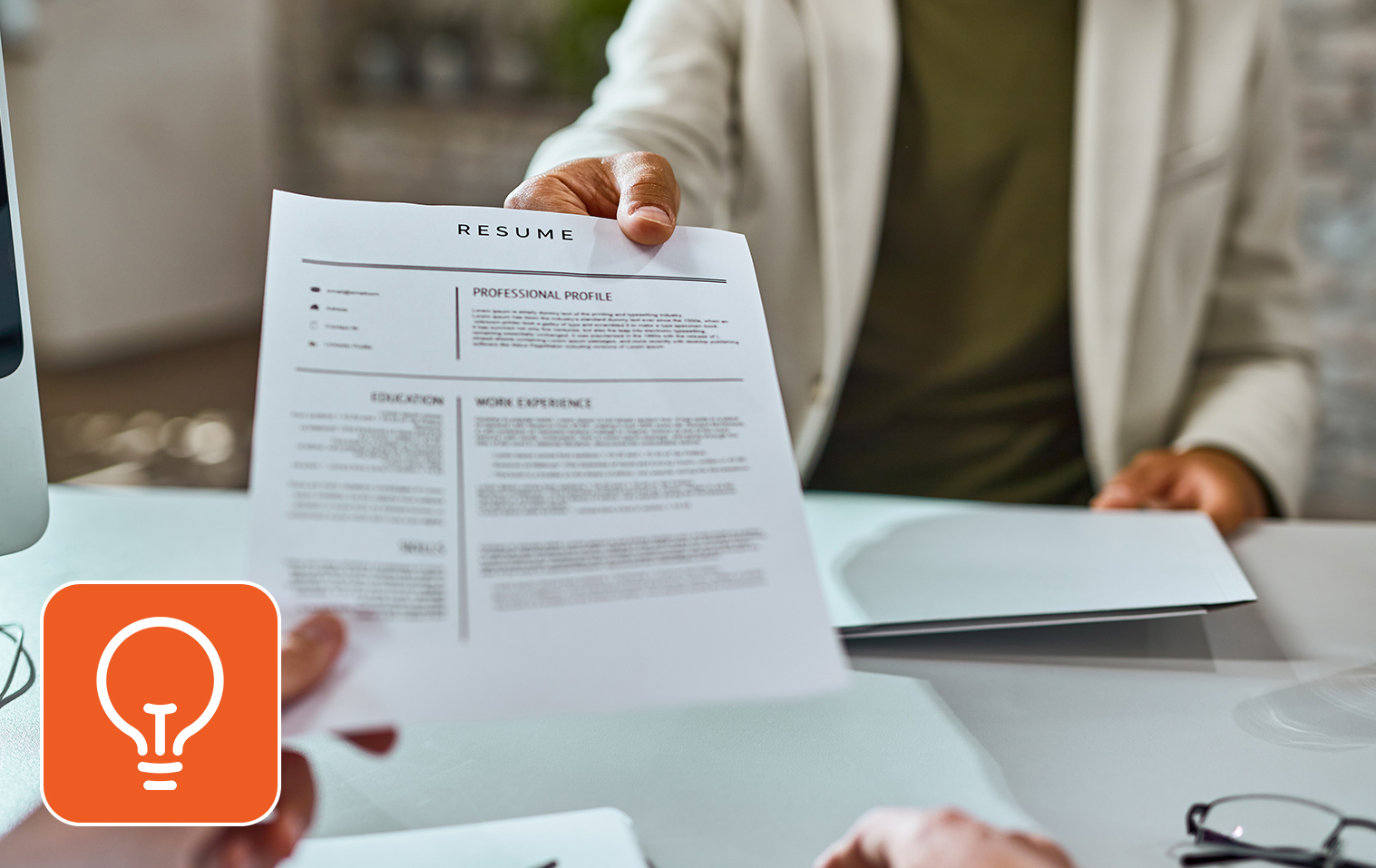 A person giving resume to an interview panelist