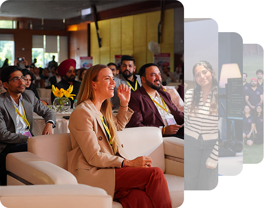 A woman sitting on a white sofa with a happy expression watching something ahead of her.