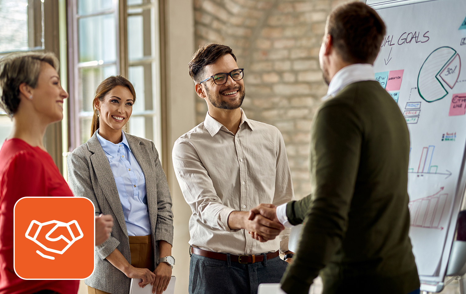 Managers happily shaking hands with the newly hired teammate