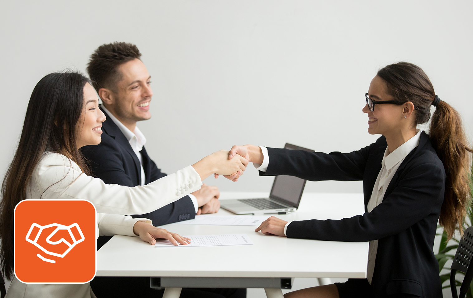 Recruiter shaking hands with an interviewee