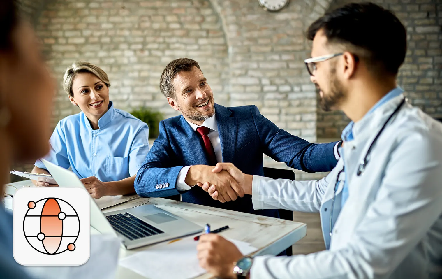 Healthcare hiring trends concept: Doctor shaking hands with hiring manager
