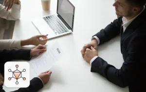 Recruiters evaluating candidate documents as part of AI in hiring