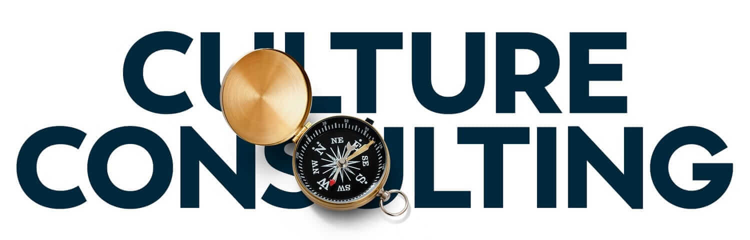 An open brass compass lies on top of the words "CULTURE CONSULTING" in bold capital letters. The compass needle points north, symbolizing direction and guidance. The image conveys a message of navigation and leadership in cultural consultancy.