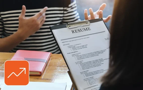 5-ways-to-stand-out-as-a-job-candidate Professional job candidate reviewing resume and skills checklist