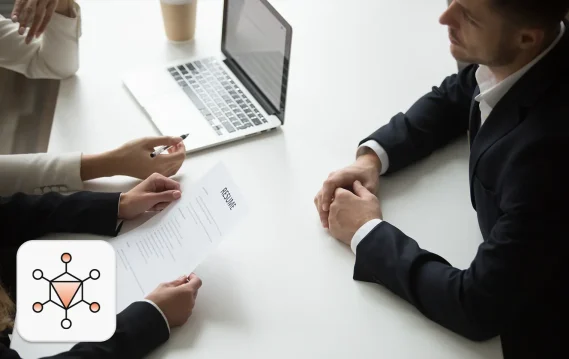 Recruiters evaluating candidate documents as part of AI in hiring