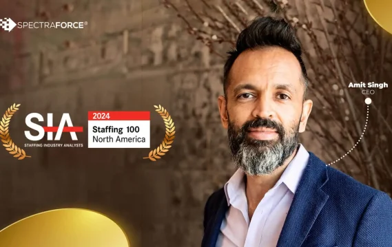Amit Singh, CEO of SPECTRAFORCE, standing before a stylish backdrop, highlighting 2024 Staffing 100 North America recognition.