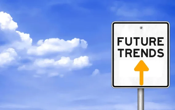 Road sign reading "FUTURE TRENDS" with an upward arrow, set against a bright blue sky with clouds, symbolizing career growth and direction.