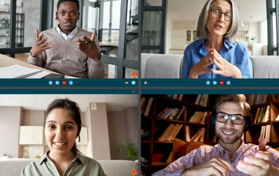 Virtual meeting with four participants engaged in conversation, with notebooks and bookshelves in the background, reflecting soft skills evaluation.