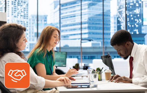 Three people working together in an office