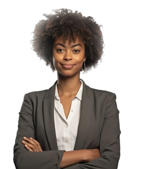 A professionally dressed woman with curly hair stands confidently with arms crossed, wearing a blazer over a white shirt, exuding professionalism and confidence.