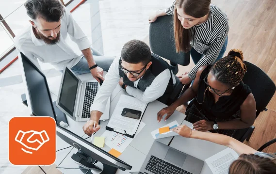 outsourced-technical-support IT team in front of computers, figuring out issues with outsourced technical support