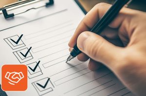 Image of someone filling a checklist with a pen